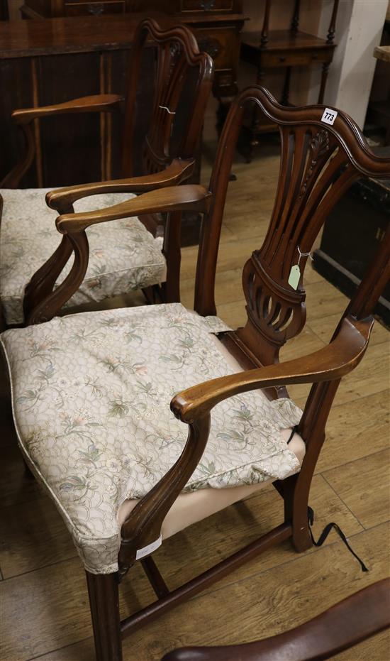 A pair of mahogany elbow chairs